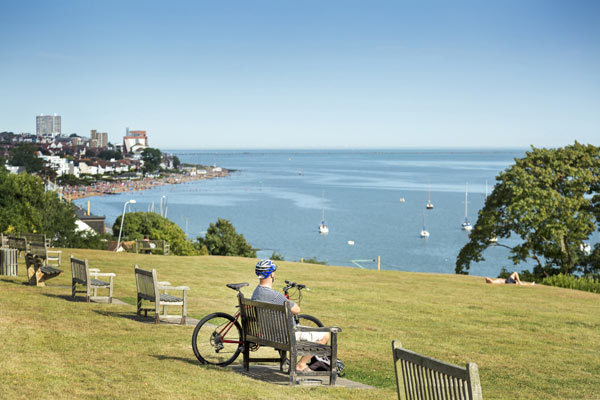 cyclist resting on bench