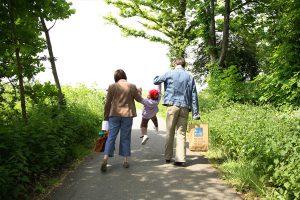 Couple lifting child at RSPB Rainham Marshes