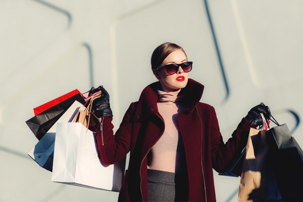 Woman shopping at lakeside shopping centre